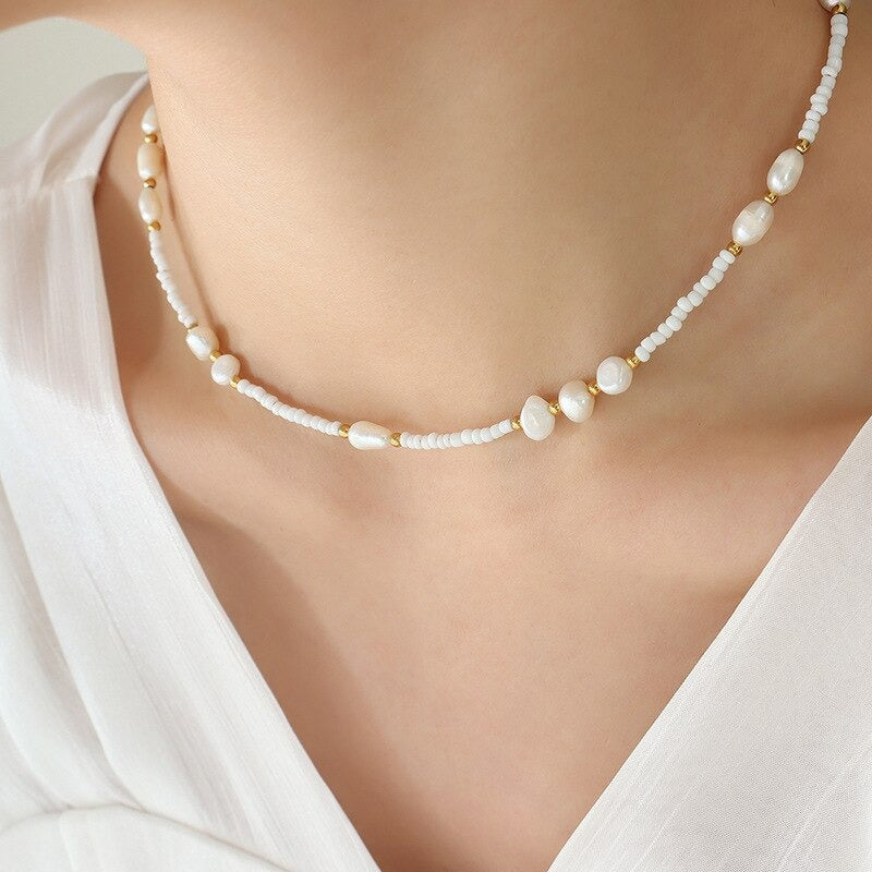 Gold Freshwater Pearl Chain Bead Necklace worn on a woman's neck with a white linen top.