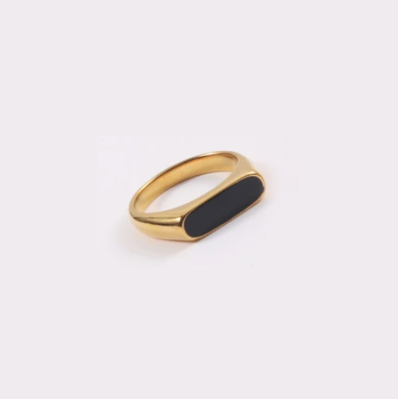 Gold Long Black Set Signet Ring on a white surface.