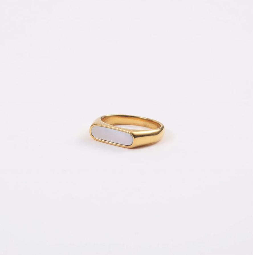 Long set slim signet ring on a white background.