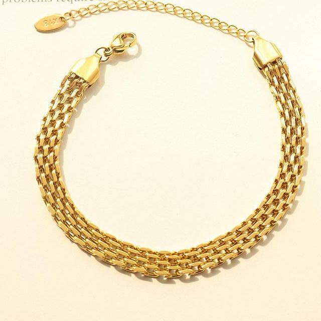 Gold Multi Layer Chain Link Bracelet on a plain white background.
