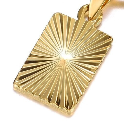 A macro view of the detail on the sunburst pendant design.