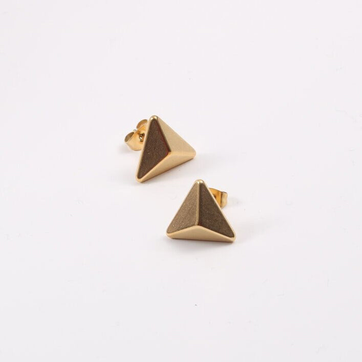 Gold Trigoni Polygon Earrings shining brilliantly on a plain white background.