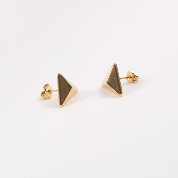 Gold Trigoni Polygon Earrings shining brilliantly on a white background.