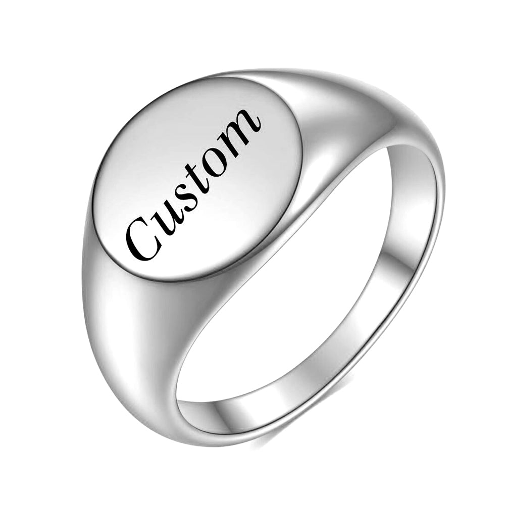 A custom silver signet ring with a round face perfect for custom engravings.