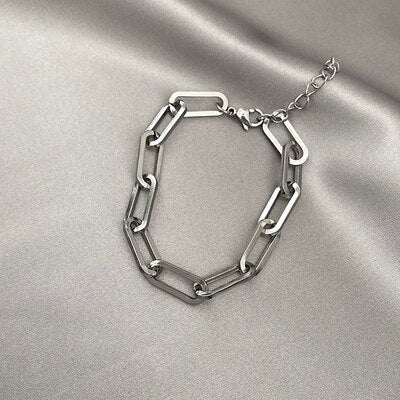 Steel Long Link Bracelet on fabric surface.